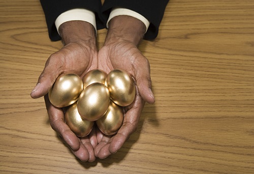 Man holding golden eggs
